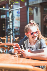 Portrait of woman sitting in restaurant