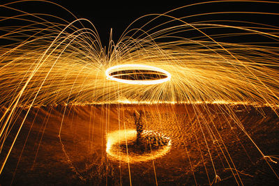 Low angle view of fire crackers at night