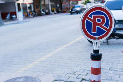 Low section of man standing on street