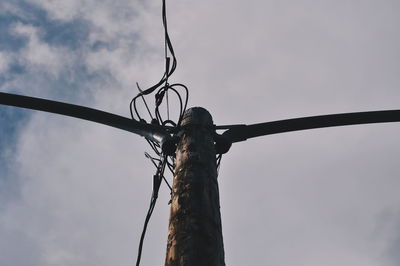 Low angle view of bare tree against sky