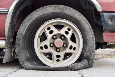 Close-up of vintage car on road