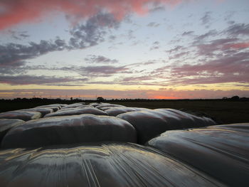 Scenic view of land against sky during sunset