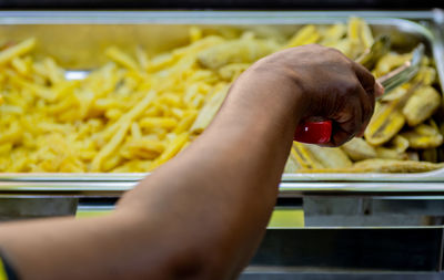 Midsection of person preparing food