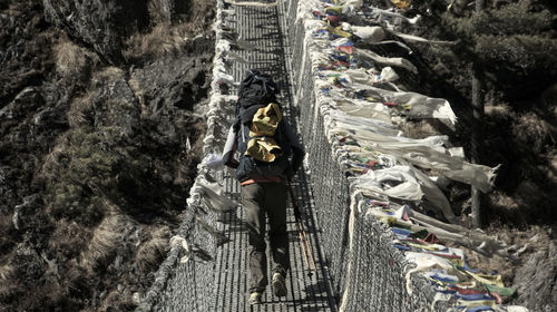 Low angle view of people on rock formation