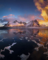 Scenic view of lake against sky during sunrise 