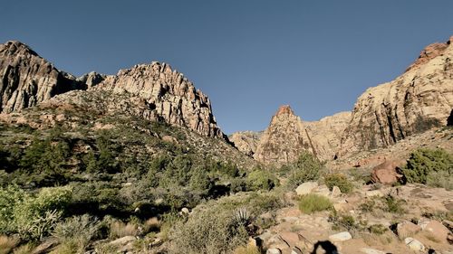 Scenic view of rocky mountains against clear sky