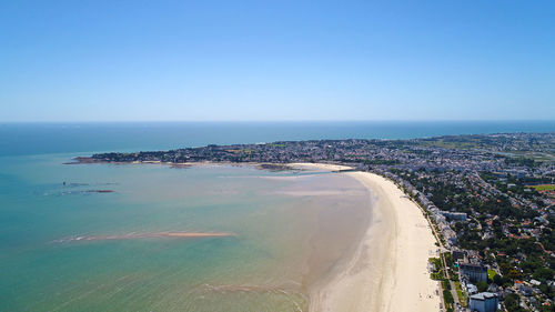 Scenic view of sea against clear blue sky