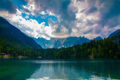 Scenic view of lake and mountains against sky