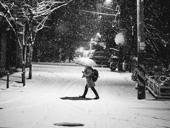 Side view of man walking on street