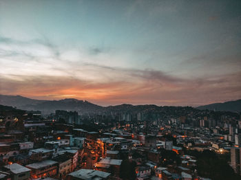 High angle shot of townscape against sky at sunset