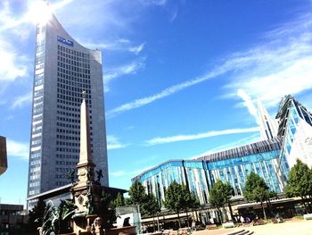 Low angle view of building against cloudy sky