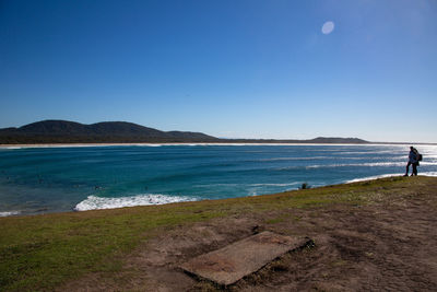 Scenic view of sea against clear blue sky