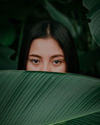 Close-up portrait of a serious young woman