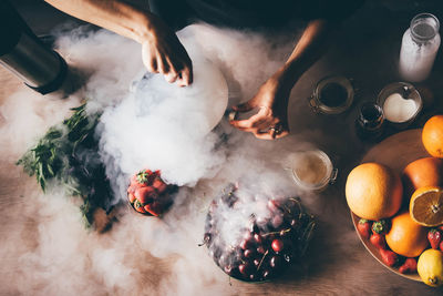 Cropped hand of man preparing food