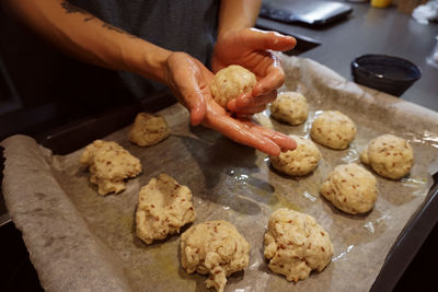 Midsection of man preparing food on table