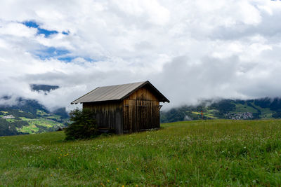 House on field against sky