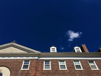 Low angle view of built structure against blue sky