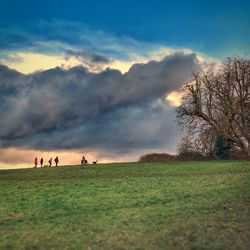 Scenic view of field against sky during sunset