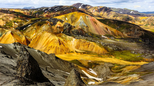 Aerial view of landscape with mountain range in background