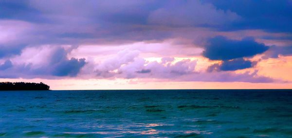 Scenic view of sea against dramatic sky