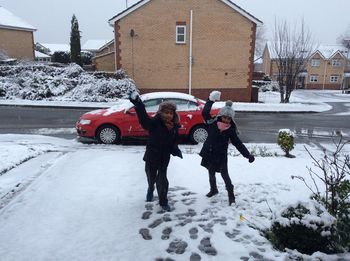 People walking on snow covered road