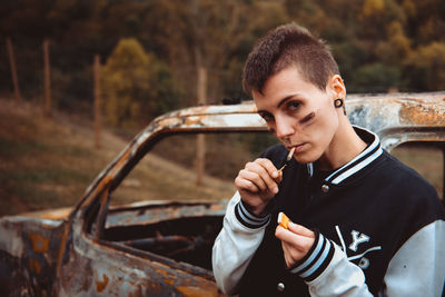 Portrait of young man in car