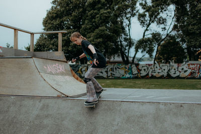 Full length of man skateboarding on skateboard