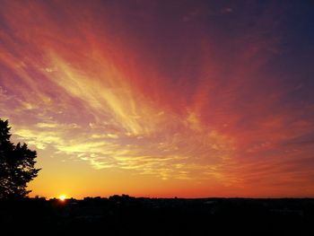 Silhouette of landscape against dramatic sky