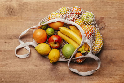 High angle view of fruits in basket on table