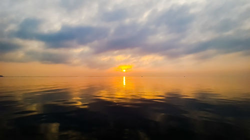 Scenic view of sea against sky at sunset