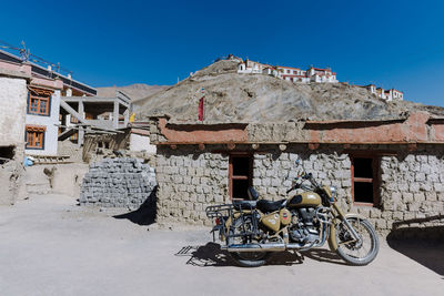 Bicycles against mountain against clear sky