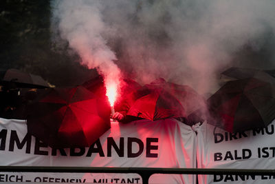 Close-up of text written on a antifa banner with fire granate