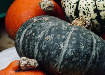 Close-up of pumpkin against stone wall