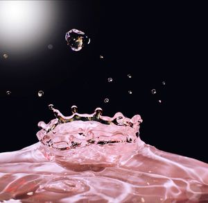 Close-up of bubbles against black background