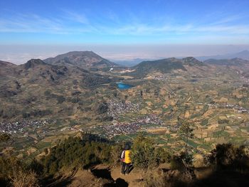 The view of the high prau mountains overlooks the sky and the city of dieng