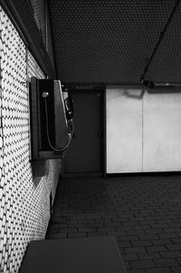 Close-up of telephone booth on wall