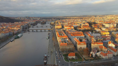 High angle view of river amidst buildings in city