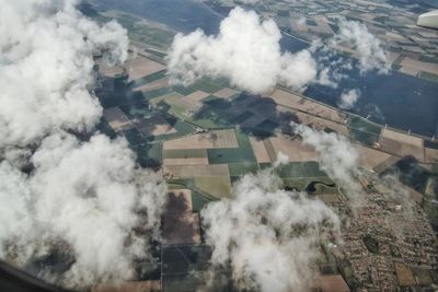 Clouds above landscape and river