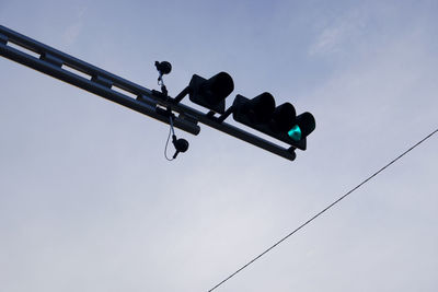 Low angle view of street light against sky