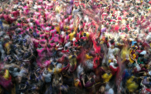 Blurred motion of people during holi