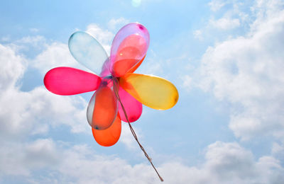 Low angle view of multi colored balloons