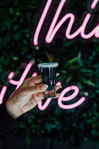 Close-up of hand holding wine glass