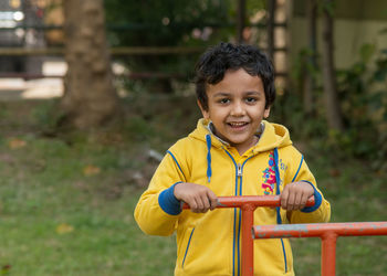 Portrait of boy playing in park