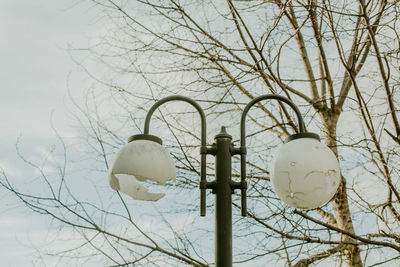 Low angle view of street light against sky