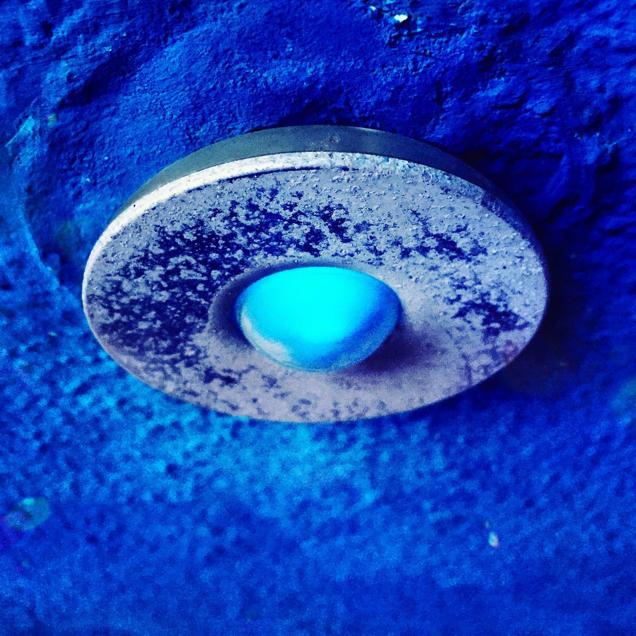 blue, circle, close-up, indoors, lighting equipment, purple, illuminated, geometric shape, no people, low angle view, glowing, shape, single object, abstract, electricity, reflection, light, directly above, hole