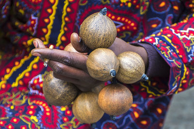 Close-up of fruit in human hand