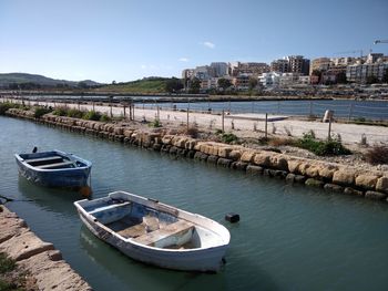 High angle view of river by buildings against sky