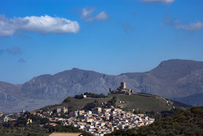 High angle view of townscape against blue sky