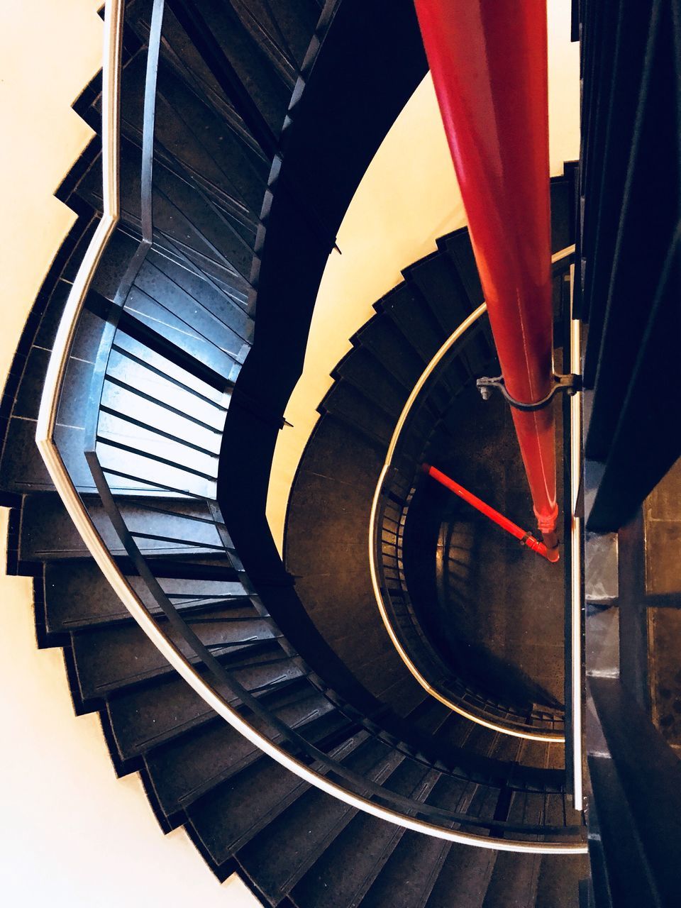 DIRECTLY BELOW SHOT OF SPIRAL STAIRCASE