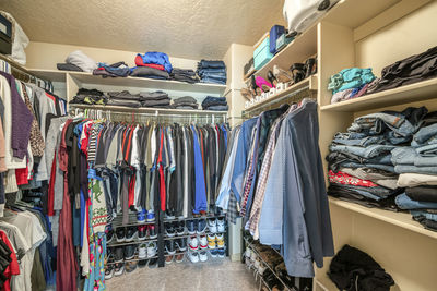 Panoramic shot of clothes hanging in rack
